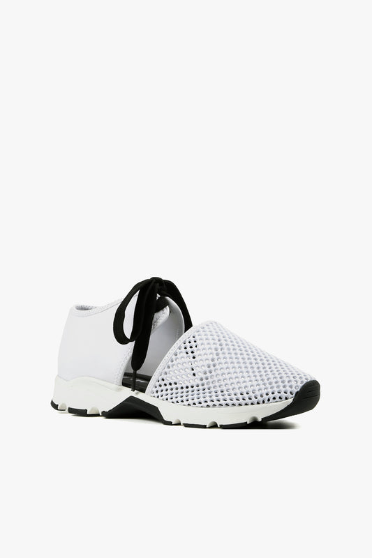 Women's white breathable mesh cutout sneakers with contrast black laces and sporty sole side view