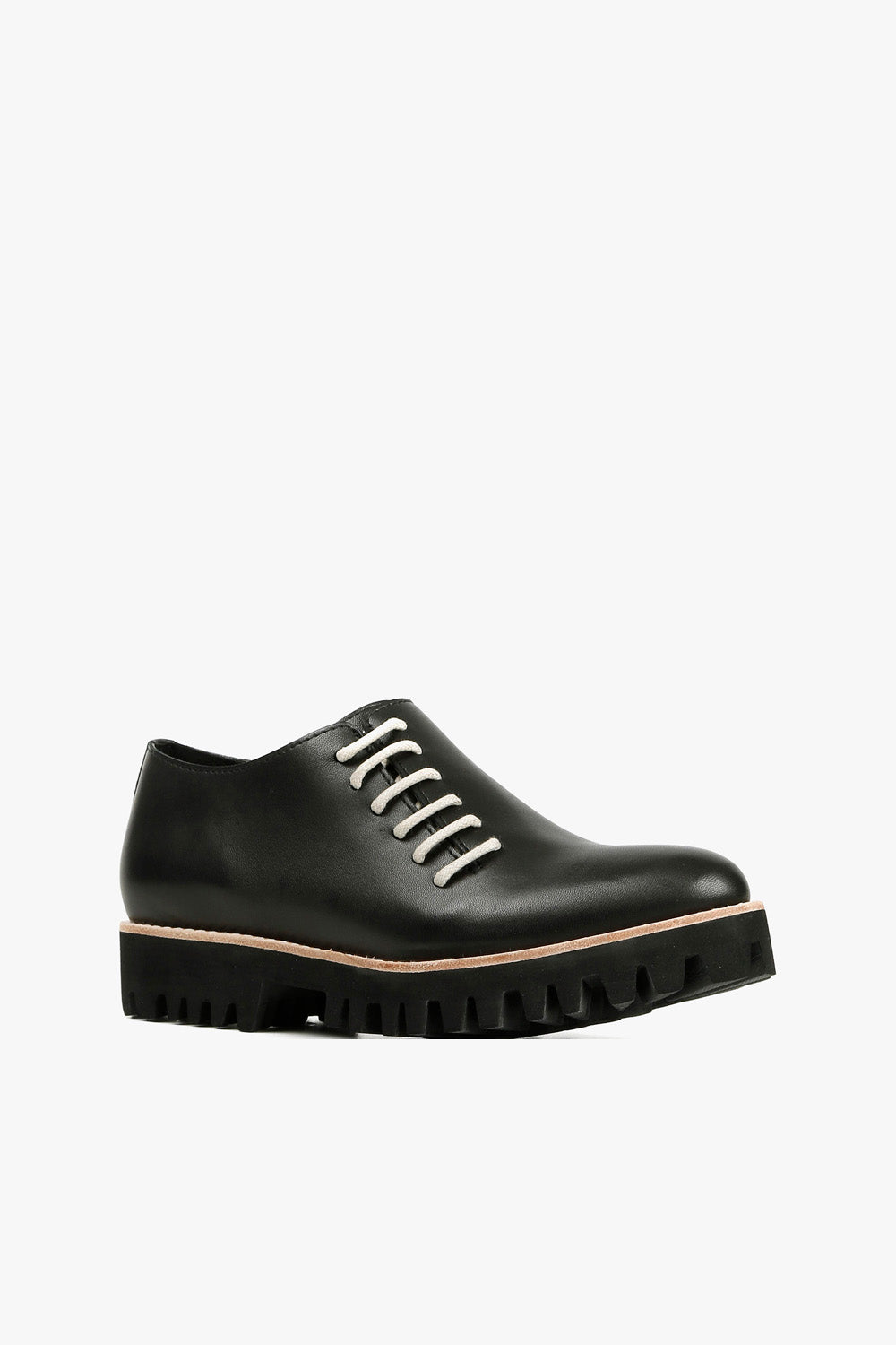 Women's black leather lace-up oxfords with contrast white round laces, natural welt detail, and chunky black lug sole side view
