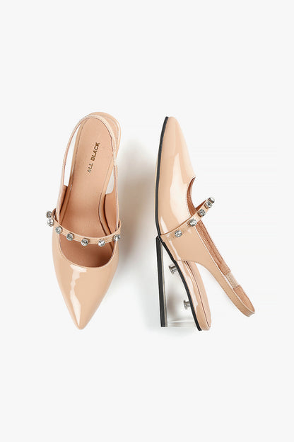 Top and side view of women's nude patent slingback shoes with clear wedge heel and jeweled strap accents.