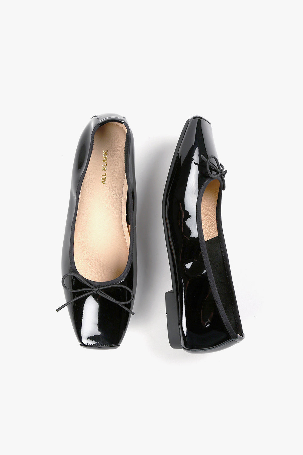 Women's square toe loafers in a mix of black leather and stretch fabric, featuring a sleek minimalist silhouette and low block heel.