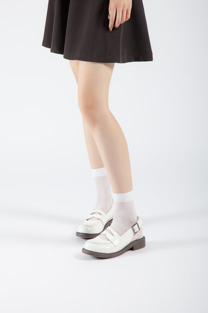 white buckle slingback Mary Jane pumps on model, vintage-inspired low heel dress shoes with feminine styling
