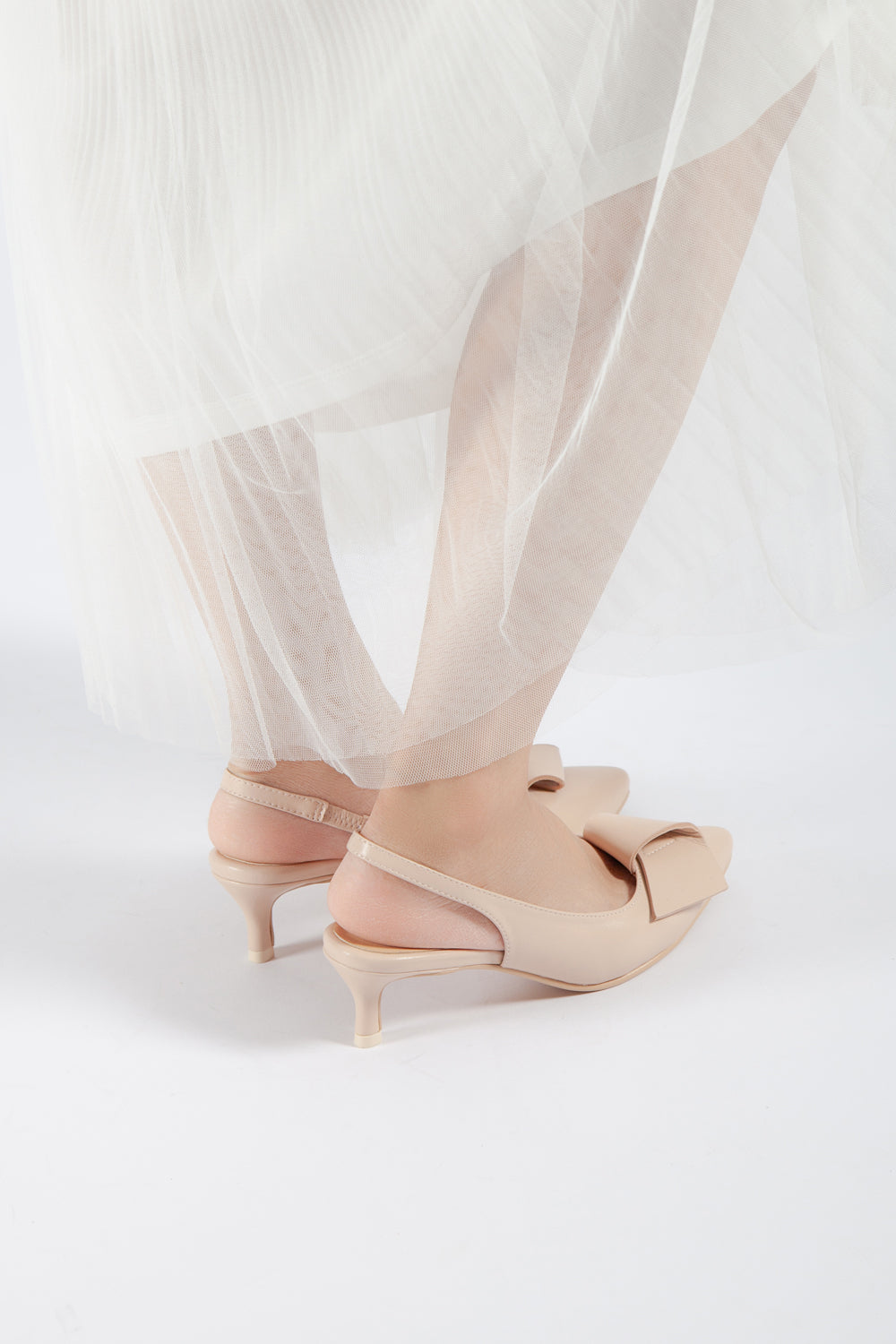 Back View of Women’s Pink Leather Flatbow Kitten Heel Slingback Pumps on Model