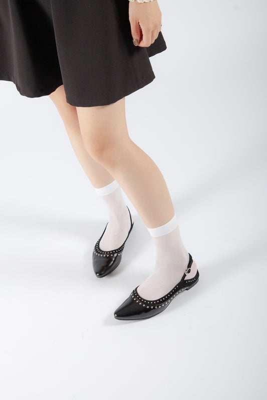 black patent leather studded slingback flats with pointed toe and silver trim, women’s edgy low heel dress shoes styled with skirt and sheer socks for fall fashion
