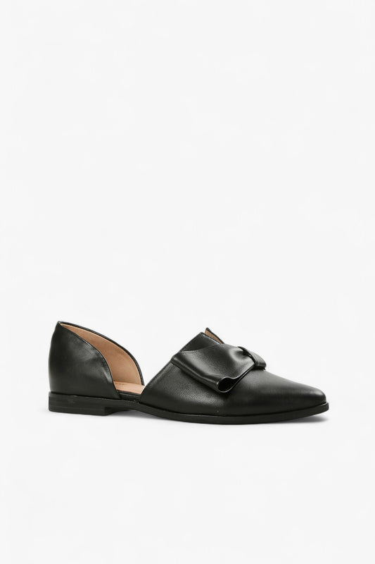black leather d’Orsay flat with oversized bow detail and round toe, women’s minimalist low heel dress shoe for modern fall styling

