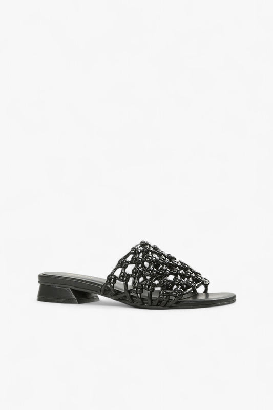 Women's black woven leather slide sandals with low geometric block heel side view.