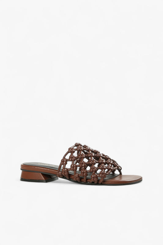 Women's coffee brown woven leather slide sandals with low geometric block heel side view.