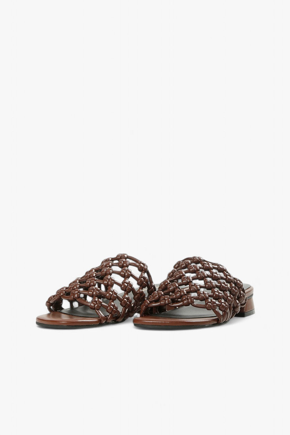 Women's coffee-colored open-toe sandals with architectural low heel and artisanal woven detail.