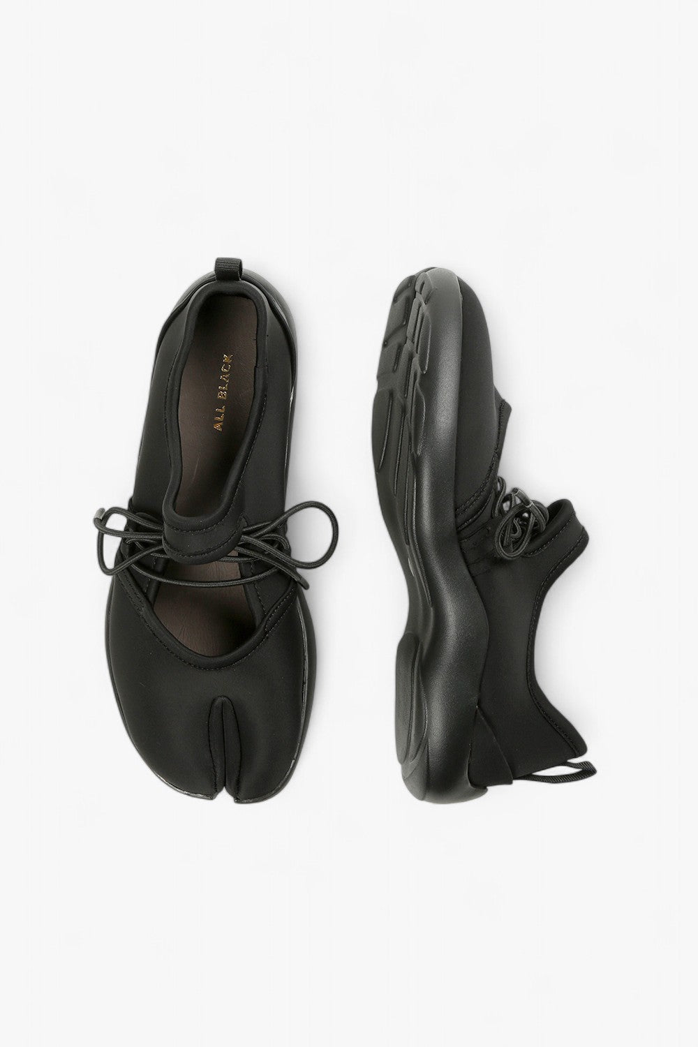 ALL BLACK split-toe leather flats, side profile of minimalist black Tabi-style ballet shoes.