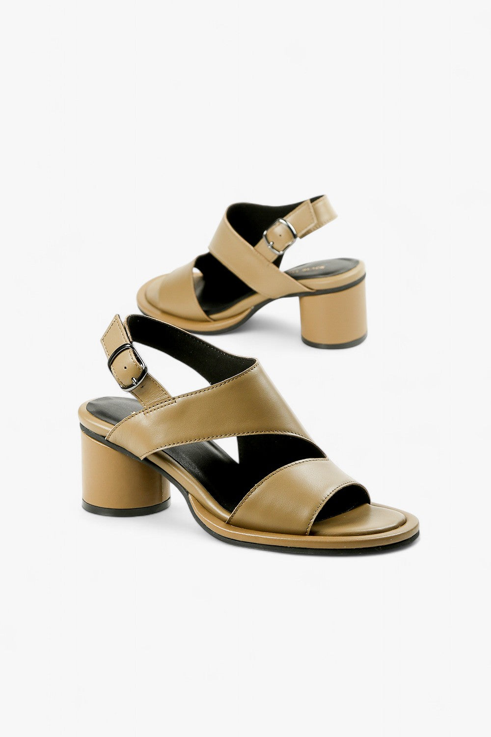 Pair of women's beige leather sandals featuring a sculptural cylindrical heel and modern geometric cutouts.
