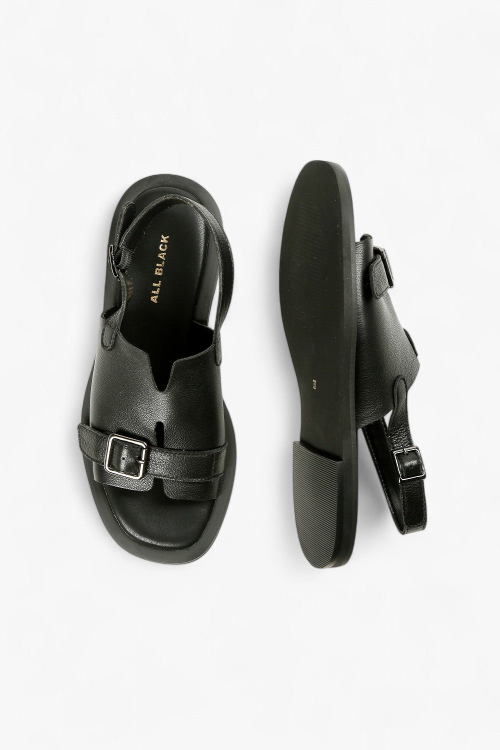 Top and sole view of women's black flat sandals with silver hardware and ergonomic footbed, ALL BLACK branding visible.