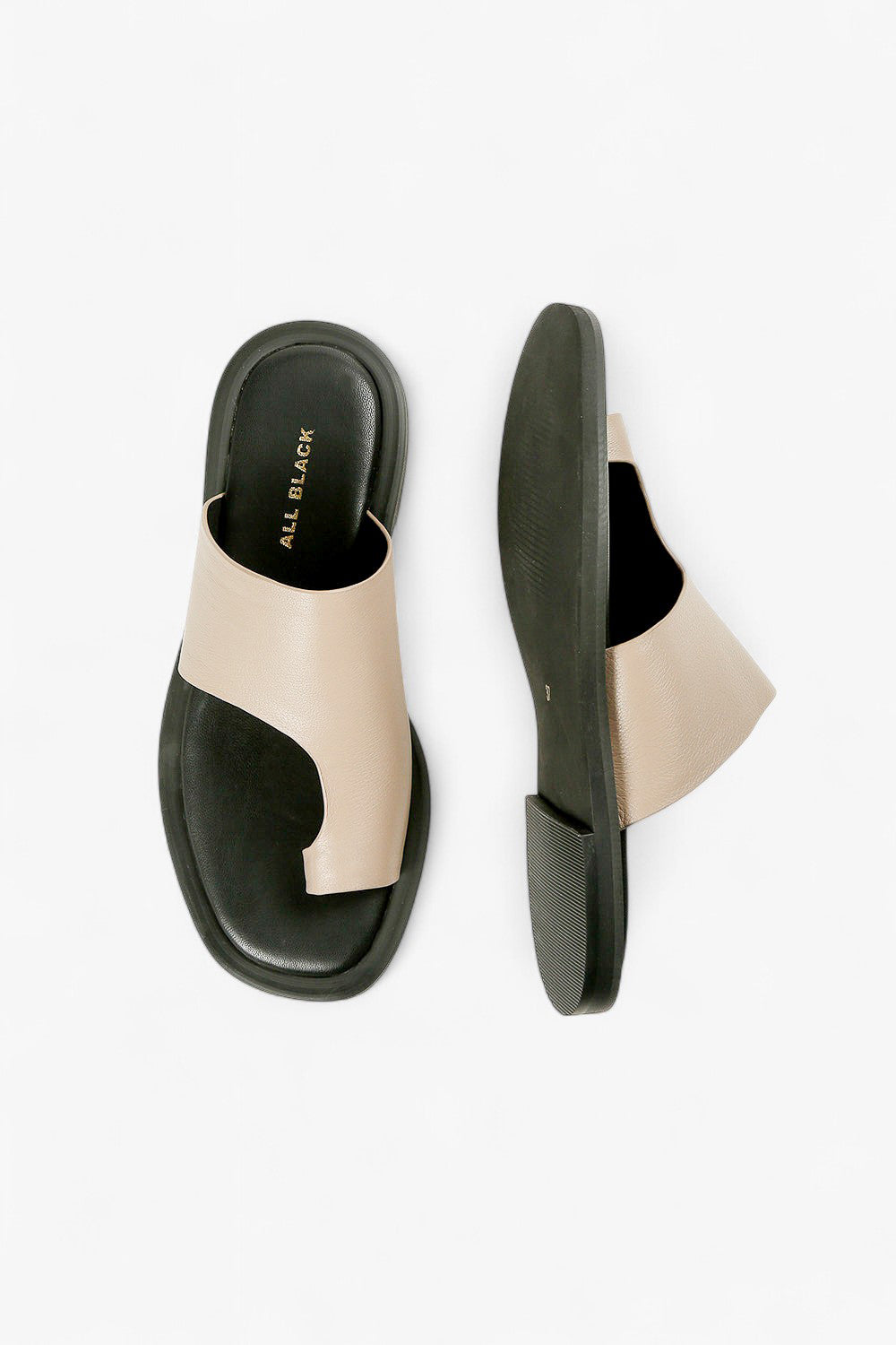 Top down and sole view of women's taupe asymmetrical slides, showcasing the ergonomic footbed and gold branding.