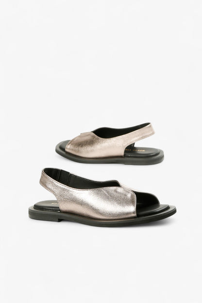 Pair of women's shimmering pewter leather sandals featuring a modern v-cut vamp and comfortable black footbed.