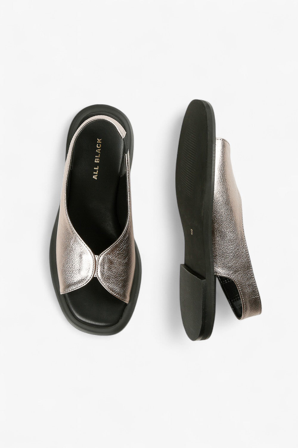 Top and sole view of women's metallic pewter slingbacks showcasing the unique asymmetrical upper and gold ALL BLACK branding.
