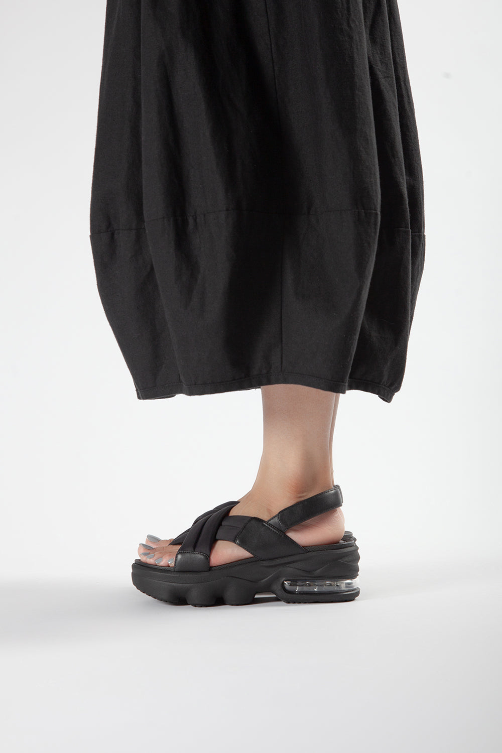 ALL BLACK Women’s Black Leather Platform Cushion Sandals Styled with Black Skirt