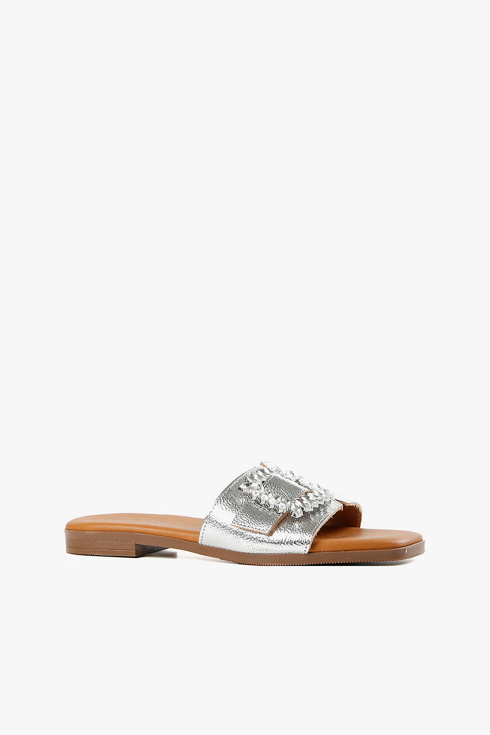 Women's metallic silver flat slide sandal with statement crystal buckle and square toe side view