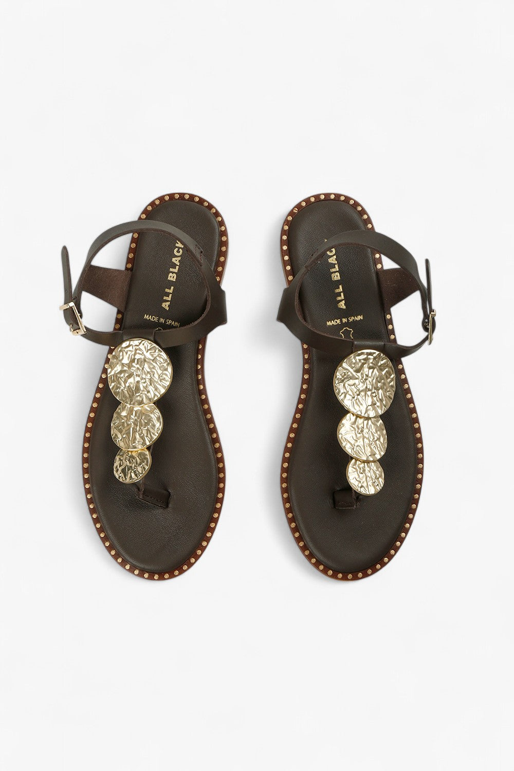Pair of women's leather marron sandals showcasing the metallic gold medallions and natural leather lining.